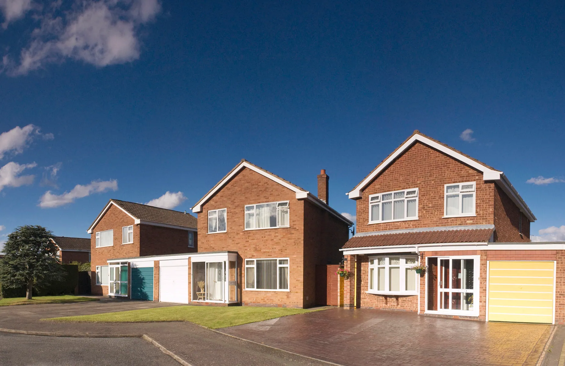 A street of existing brick family homes, the housing stock Homebuild Retrofit upgrades